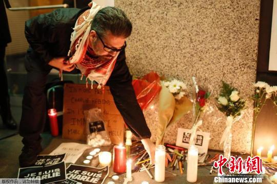 综述:恐袭阴云笼罩法兰西哀悼伊始枪声又起